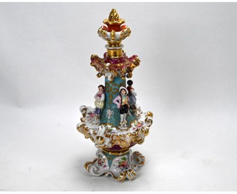 A 19th Century Continental porcelain scent flask and stopper of ornate design with figures of four 'childhood sweethearts' am