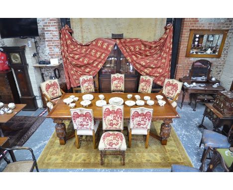 A substantial solid oak refectory style dining table and set of eight dining chairs by 'Royal Oak Furniture Company, North Yo