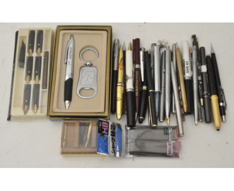 A collection of vintage pens and pencils, including Parker