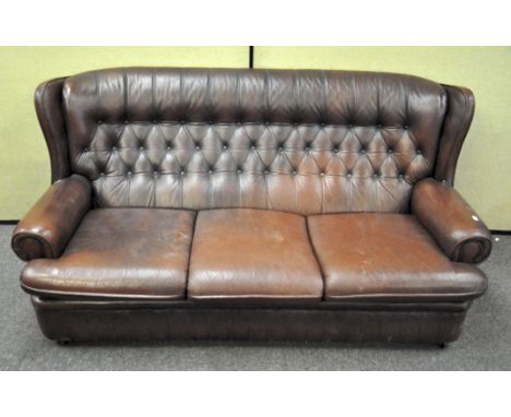 A large vinyl three seater Chesterfield style sofa with button back, 85cm x 170cm x 86cm 