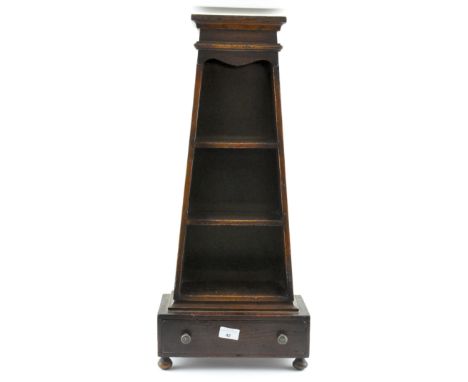 An unusual wooden ammunition holder/tiered unit of graduating form, three shelves over a single drawer, 69cm high
