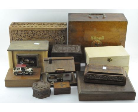 A large collection of vintage wooden boxes to include some carved examples.