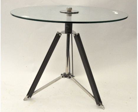 A vintage glass topped coffee table,  on tripod base