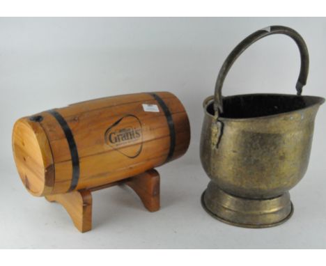 A table top William Grants Scotch whiskey barrel, 38cm long, together with a hammered brass coal bucket, 31cm high