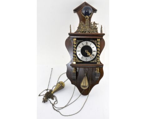 A vintage Dutch wall clock, the top adorned with a finial in the form of Atlas, the silvered dial with Roman numerals denotin
