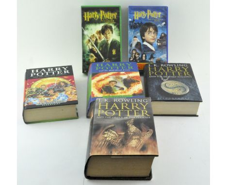 A collection of Harry Potter books, to include First Editions and VHS Potter films 
