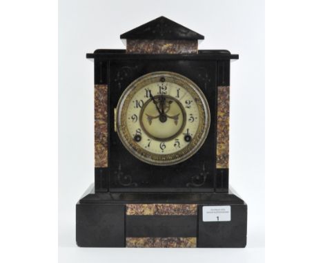 A Victorian slate mantel clock with marble inlay and partially exposed mechanism to dial, which has Arabic numerals denoting 