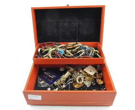 A selection of costume jewellery in a vintage jewellery box