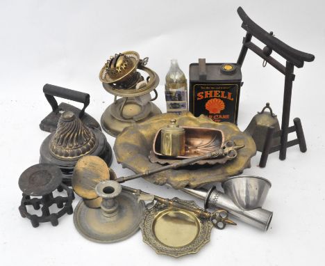 A group of assorted metalware, including a brass oil lamp, a silver-plated chamber stick and a reproduction Shell oil can 