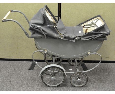 A vintage double dolls pram, with suspension, 69cm tall