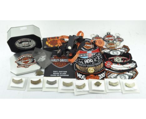 A collection of Harley Davidson memorabilia, badges etc, including a boxed belt buckle