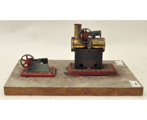 A vintage tin plate Mamod steam engine and hammer on base. 