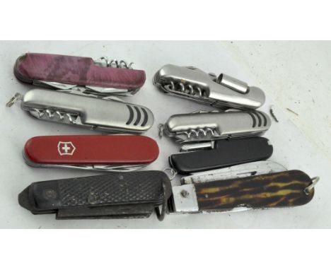 A group of eight Swiss Army knives