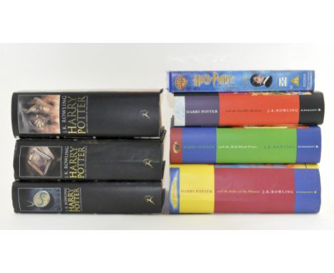 A collection of hardback First Edition Harry Potter books, including "the order of the Phoenix" and 'The Deathly Hallows'