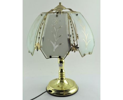 A modern gilt metal three light table lamp with opaque floral shade, 52 cm, high 