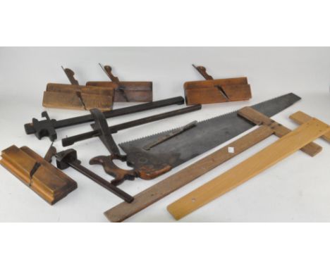 Assorted tools, including an early F Read saw, 82cm long, a box plane and other items