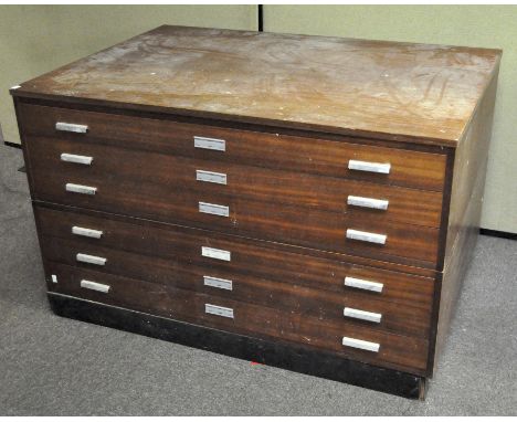 A vintage late 20th century teak veneered six drawer plan chest with metal handles to front, all raised on plinth base. 79cm 