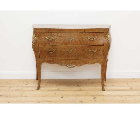 A parquetry bombé commode chest,18th century, Italian, the serpentine top above two drawers with gilt-metal mounts and handle