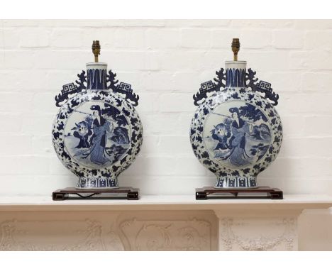 A pair of Chinese blue and white moon flask table lamps, 20th century, on fixed hardwood stands, 57cm high, one shade (2)Cond