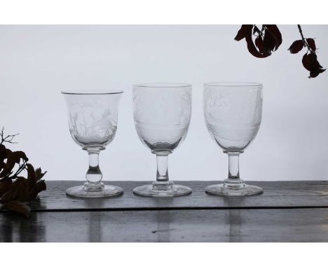 A group of three Victorian shipping glasses, mid-19th century, comprising:a pair, each engraved with a ship at full sail, tit