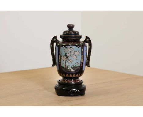 A Japanese cloisonné vase and cover,early 20th century, with two handles, finely decorated with four panels of birds and butt