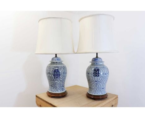 A near pair of large Chinese porcelain vase table lamps,late 19th/early 20th century, each of baluster shape, painted in unde