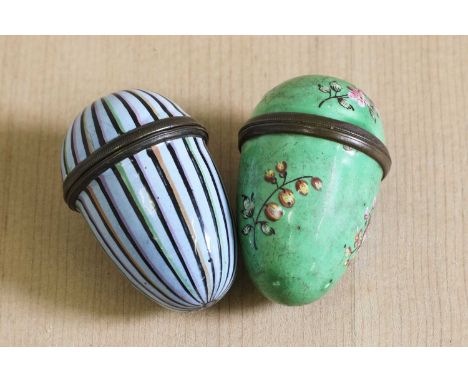 Two George III enamel egg-shaped nutmeg graters,c.1790s, one decorated with multicoloured stripes on a blue ground, the secon