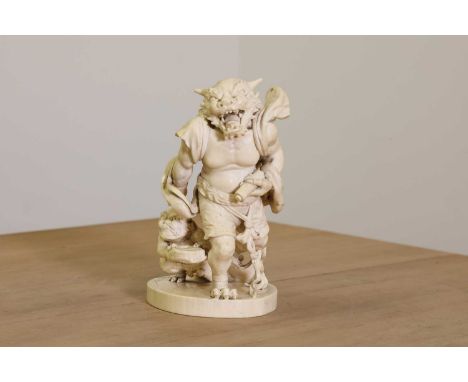 A Japanese solid carved ivory oni okimono,Meiji period (late 19th century), the larger figure striding forth, his crouching a