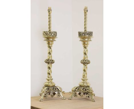 A pair of impressive brass altar stick lamps,19th century, each with a pierced ornate galleried drip pan, twist moulded colum