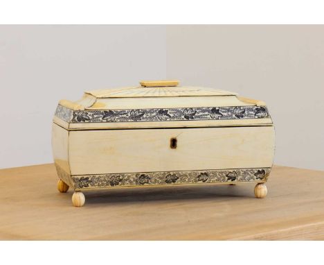 An Anglo-Indian ivory tea caddy,c.1810-1820, Vizagapatam, of sarcophagus form and decorated with penwork foliate borders, ope