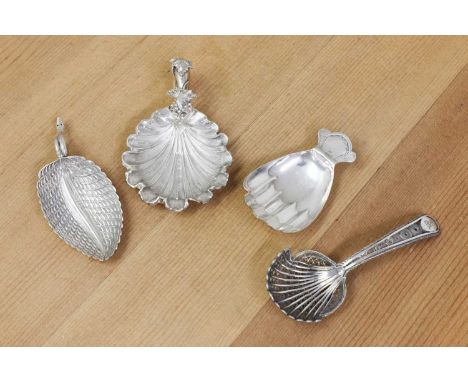 A Victorian silver caddy spoon,by George Unite, Birmingham 1860,with a frosted shell-shaped bowl and hollow two-ring handle a
