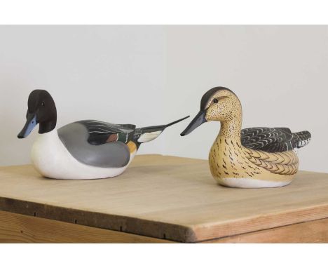 A pair of carved decoy ducks,20th century, by Ward &amp; Bell of Crisfield, Maryland,drake 51cm long (2)Condition report: lig