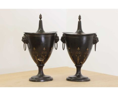 A pair of Regency-style toleware chestnut urns and covers,late 19th/early 20th century, each of goblet form, with an acorn fi