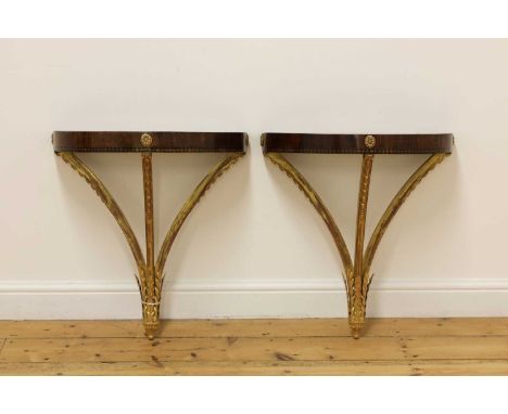 A pair of demilune console tables,second half of the 20th century, each top with radiating sunburst inlay, over three curved 