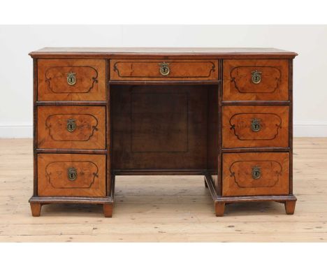 A Northern European parquetry-inlaid specimen wood twin pedestal desk,probably late 18th/early 19th century, the serpentine t