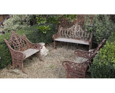 A cast iron garden suite,early 20th century, Indian, in the manner of the Coalbrookdale ironworks, consisting of two chairs a