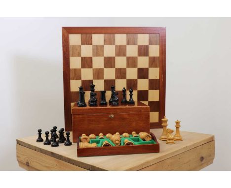 A Staunton Grandmaster chess set by Jaques of London,of recent manufacture, the chessmen carved in boxwood and ebony, each pi