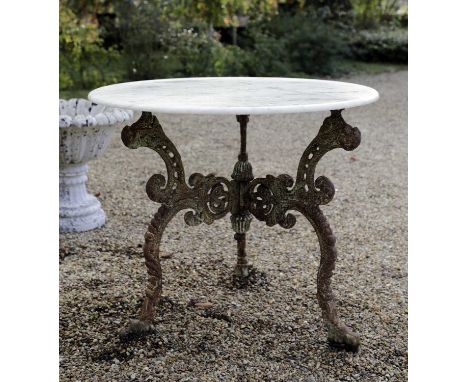 A marble-topped iron garden table,20th century, Indian, the circular top on a scrolling triform base,90cm diameter77cm highCo