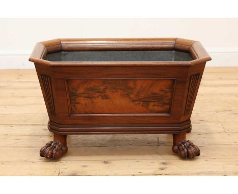 A large Regency mahogany open wine cooler,early 19th century, of sarcophagus form with panelled sides fitted with a lead lini