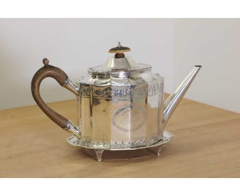 A George III silver teapot and stand,by Robert Hennell (I), London 1791,of oval, panelled form with scalloped shoulder and hi