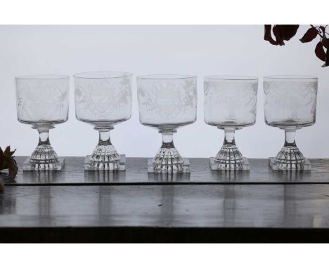 A composed group of glass farming rummers,c.1810, comprising:a pair, each engraved with a shield depicting farming implements