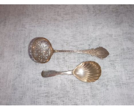 A VICTORIAN SILVER STRAINING SPOON with engraved decoration by George Unite and a Victorian silver caddy spoon (2)