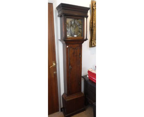 AN EARLY 18TH CENTURY OAK LONGCASE CLOCK with brass dial, thirty-hour movement inscribed with the initials 'T.A.M.',  75.5" h