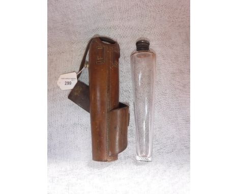 A LATE VICTORIAN/EARLY 20TH CENTURY GLASS AND WHITE METAL MOUNTED HUNTING FLASK of tapered cylindrical form in original leath