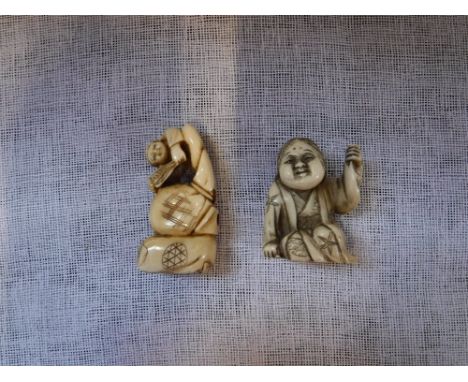 TWO JAPANESE CARVED IVORY NETSUKE in the form of figures, one signed, 19th century, 1.5" and 2" (2)