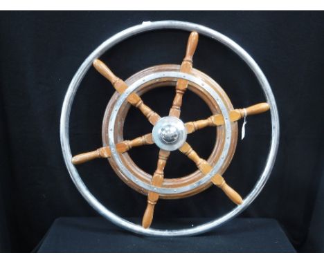 A VINTAGE TEAK AND CHROME BOAT STEERING WHEEL, 26" dia