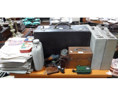A LEATHER SUITCASE CONTAINING BUTTONS, a collection of sheet music, vintage torches and sundries