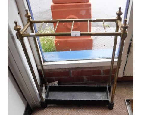 A VICTORIAN STYLE BRASS STICK-STAND with an iron base, 18.5" wide