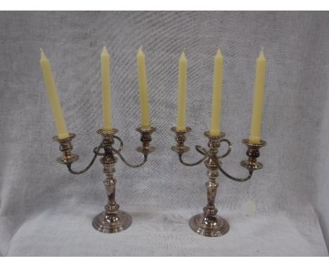 A PAIR OF SILVER PLATED CANDELABRA 