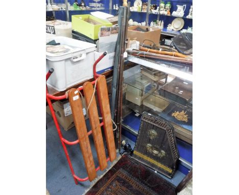 A SELECTION OF VARIOUS VINTAGE FISHING RODS, a child's sled an a 19th century zither